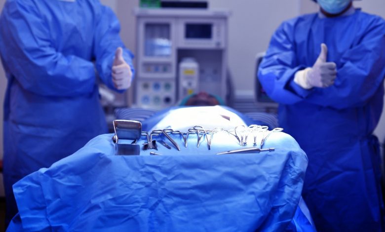 surgeons using bone holding forceps